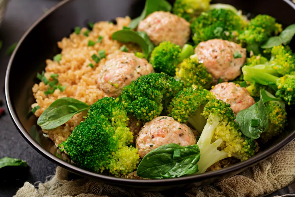 Baked meatballs of chicken fillet with garnish with quinoa 