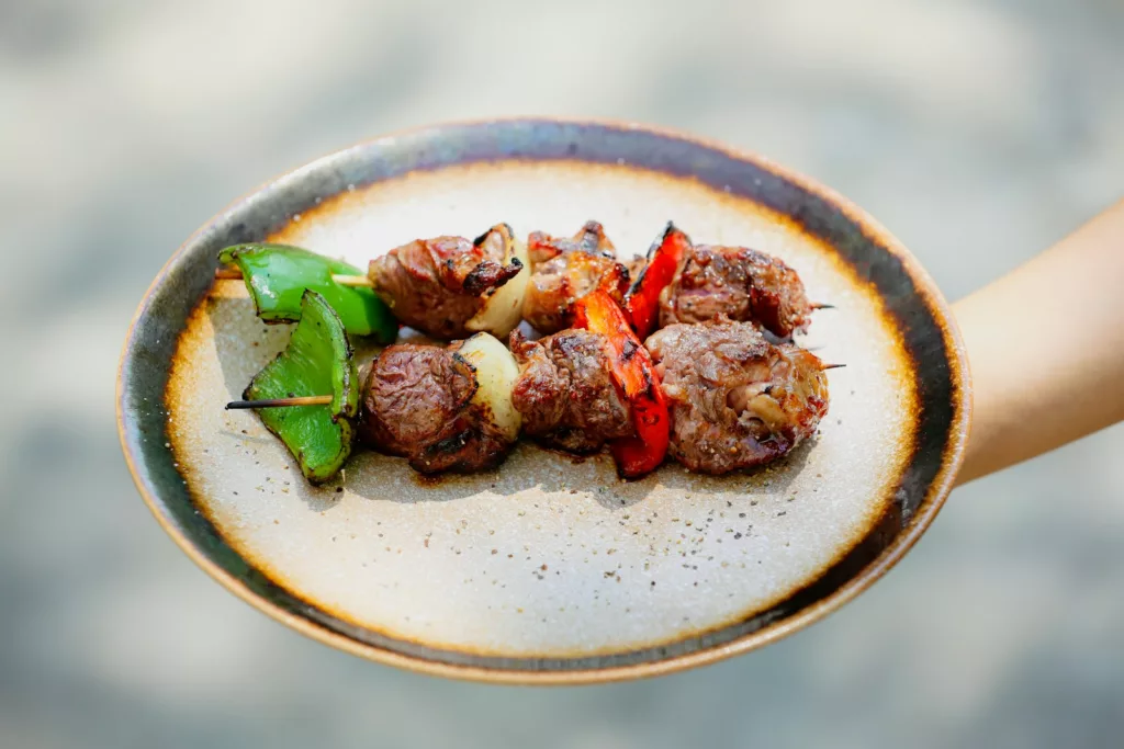 a plate of BEEF SKEWERS